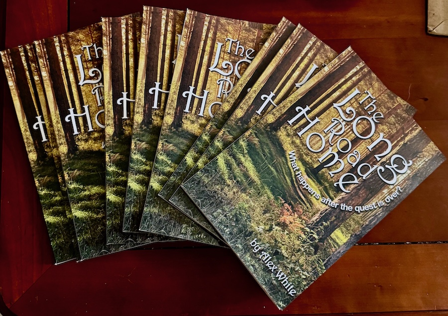 a spread of Long Road Home books on a wooden table